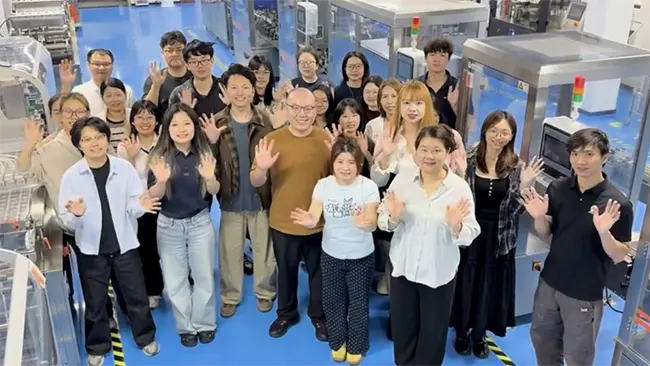Rich Packing team group photo inside pharmaceutical packaging machinery workshop